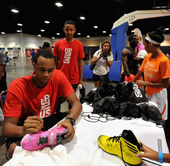 TAMPA, FL - JULY 19:    John Henson signs autographs at the John Henson Experience benefitting Up2Us at the Tampa Bay Youth Sports Expo on July 19, 2014 in Tampa, Florida.  The event raises money to put coach-mentors in the Tampa community.   (Photo by Tim Boyles/Getty Images for Up2Us)